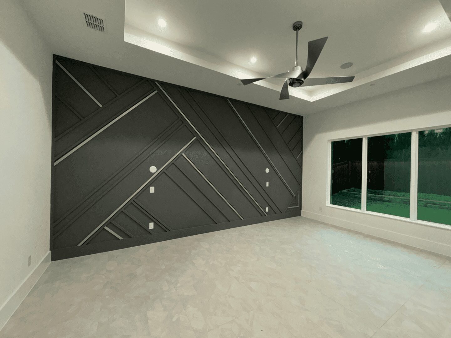 Modern room with geometric accent wall.