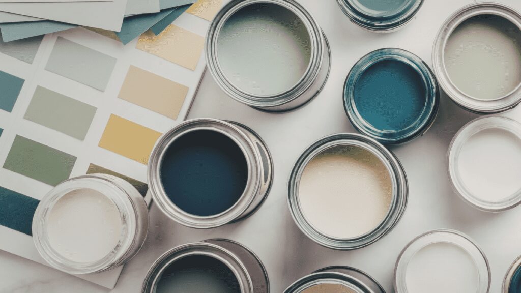Open paint cans and color swatches.